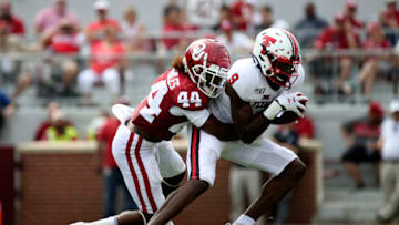 Sep 28, 2019; Norman, OK, USA; Oklahoma Sooners defensive back Brendan Radley-Hiles (44) tackles Texas Tech Red Raiders wide receiver T.J. Vasher (9) during the first half at Gaylord Family - Oklahoma Memorial Stadium. Mandatory Credit: Kevin Jairaj-USA TODAY Sports