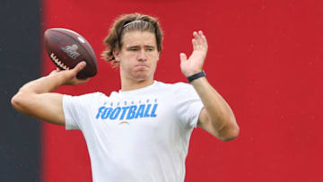 TAMPA, FLORIDA - OCTOBER 04: Justin Herbert #10 of the Los Angeles Chargers warms up before the start of a game against the Tampa Bay Buccaneers at Raymond James Stadium on October 04, 2020 in Tampa, Florida. (Photo by James Gilbert/Getty Images)