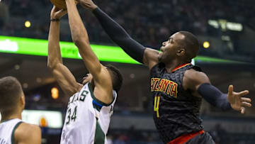 Jan 15, 2016; Milwaukee, WI, USA; Atlanta Hawks forward Paul Millsap (4) blocks the shot of Milwaukee Bucks forward Giannis Antetokounmpo (34) during the second quarter at BMO Harris Bradley Center. Mandatory Credit: Jeff Hanisch-USA TODAY Sports