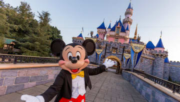 ANAHEIM, CA - AUGUST 27: Mickey Mouse poses in front of Sleeping Beauty Castle at Disneyland Park on August 27, 2019 in Anaheim, California. Disneyland plans to reopen on April 30, 2021. (Photo Joshua Sudock/Walt Disney World Resorts via Getty Images)
