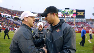 AMES, IA - OCTOBER 14: Head coach David Beaty of the Kansas Jayhawks , left, shakes hands with head coach Matt Campbell of the Iowa State Cyclones at mid field after his team lost 45-0 to the Iowa State Cyclones iat Jack Trice Stadium on October 14, 2017 in Ames, Iowa. The Iowa State Cyclones won 45-0 over the Kansas Jayhawks. (Photo by David Purdy/Getty Images)