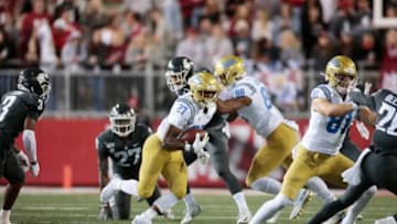 PULLMAN, WASHINGTON - SEPTEMBER 21: Joshua Kelley #27 of the UCLA Bruins carries the ball against the Washington State Cougars in the second half at Martin Stadium on September 21, 2019 in Pullman, Washington. UCLA defeats Washington State 67-63. (Photo by William Mancebo/Getty Images)