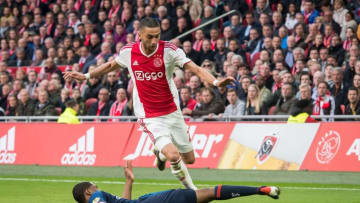 (L-R) Denzel Dumfries of PSV, Hakim Ziyech of Ajax during the Dutch Eredivisie match between Ajax Amsterdam and PSV Eindhoven at the Johan Cruijff Arena on March 31, 2019 in Amsterdam, The Netherlands(Photo by VI Images via Getty Images)