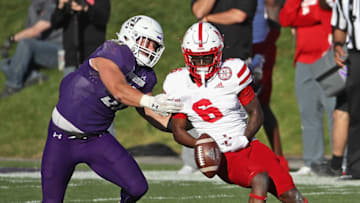 EVANSTON, ILLINOIS - NOVEMBER 07: Marcus Fleming #6 of the Nebraska Cornhuskers drops a pass under pressure from Blake Gallagher #51 of the Northwestern Wildcats at Ryan Field on November 07, 2020 in Evanston, Illinois. Northwestern defeated Nebraska 21-13. (Photo by Jonathan Daniel/Getty Images)