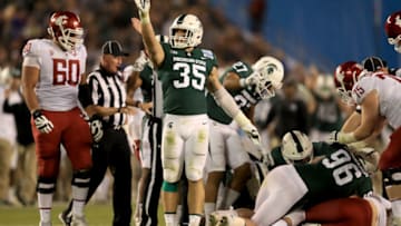 SAN DIEGO, CA - DECEMBER 28: Joe Bachie #35 of the Michigan State Spartans motions a first down after Michigan State Spartans recover a fumble by the Washington State Cougars during the second half of the SDCCU Holiday Bowl at SDCCU Stadium on December 28, 2017 in San Diego, California. (Photo by Sean M. Haffey/Getty Images)