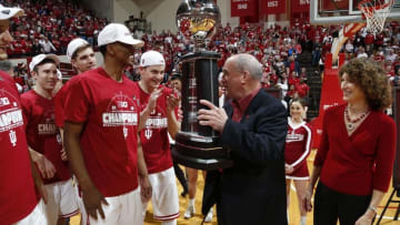 Mar 6, 2016; Bloomington, IN, USA; Indiana Hoosiers forwards Troy Williams (5) with Indiana University president Michael McRobbie as he holds the Big Ten championship trophy after defeating the Maryland Terrapins at Assembly Hall. Indiana defeats Maryland 80-62. Mandatory Credit: Brian Spurlock-USA TODAY Sports