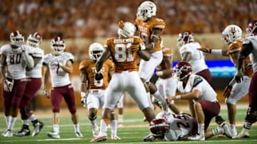 AUSTIN, TX - AUGUST 31: Hassan Ridgeway #81 of the Texas Longhorns celebrates with teammates after making a tackle for a loss of yards against the New Mexico State Aggies on August 31, 2013 at Darrell K Royal-Texas Memorial Stadium in Austin, Texas. (Photo by Cooper Neill/Getty Images)