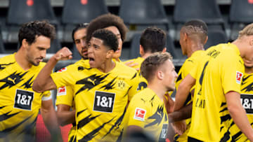 DORTMUND, GERMANY - SEPTEMBER 19: (BILD ZEITUNG OUT) Giovanni Reyna of Borussia Dortmund with Jude Bellingham of Borussia Dortmund celebrates after scoring his team's first goal with team mates during the Bundesliga match between Borussia Dortmund and Borussia Moenchengladbach at Signal Iduna Park on September 19, 2020 in Dortmund, Germany. Fans are set to return to Bundesliga stadiums in Germany despite to the ongoing Coronavirus Pandemic. Up to 20% of stadium's capacity are allowed to be filled. Final decisions are left to local health authorities and are subject to club's hygiene concepts and the infection numbers in the corresponding region. (Photo by Alex Gottschalk/DeFodi Images via Getty Images)