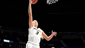 NASHVILLE, TN - MARCH 01: Missouri Tigers guard Sophie Cunningham (3) makes the lay up as Mississippi Lady Rebels guard Chyna Nixon (0) chases during the third period between the Missouri Tigers and the Ole Miss Rebels in a SEC Women's Tournament game on March 1, 2018, at Bridgestone Arena in Nashville, TN. (Photo by Steve Roberts/Icon Sportswire via Getty Images)