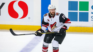 WINNIPEG, MB - OCTOBER 15: Derek Stepan #21 of the Arizona Coyotes keeps an eye on the play during third period action against the Winnipeg Jets at the Bell MTS Place on October 15, 2019 in Winnipeg, Manitoba, Canada. The Coyotes defeated the Jets 4-2. (Photo by Jonathan Kozub/NHLI via Getty Images)