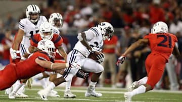 TUCSON, AZ - SEPTEMBER 01: Running back Squally Canada #22 of the Brigham Young Cougars rushes the football against the Arizona Wildcats during the college football game at Arizona Stadium on September 1, 2018 in Tucson, Arizona. The Cougars defeated the Wildcats 28-23. (Photo by Christian Petersen/Getty Images)