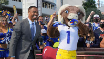 Auburn footballSep 12, 2021; Inglewood, California, USA; NBC Sports Sunday Night Football broadcaster Rodney Harrison (left) and Los Angeles Rams mascot Rampage at American Airlines plaza at SoFi Stadium. Mandatory Credit: Kirby Lee-USA TODAY Sports