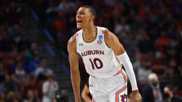 Auburn basketballMar 18, 2022; Greenville, SC, USA; Auburn Tigers forward Jabari Smith (10) celebrates a basket against the Jackson State Tigers during the first round of the 2022 NCAA Tournament at Bon Secours Wellness Arena. Mandatory Credit: Bob Donnan-USA TODAY Sports