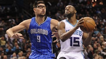 Dec 9, 2016; Charlotte, NC, USA; Charlotte Hornets guard Kemba Walker (15) drives past Orlando Magic center Nikola Vucevic (9) to score during the second half of the game at the Spectrum Center. Hornets win 109-88. Mandatory Credit: Sam Sharpe-USA TODAY Sports