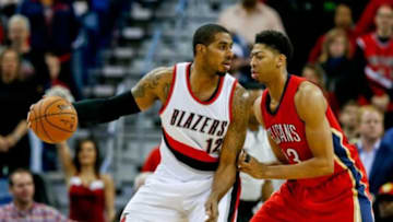 Dec 20, 2014; New Orleans, LA, USA; Portland Trail Blazers forward LaMarcus Aldridge (12) is guarded by New Orleans Pelicans forward Anthony Davis (23) during the first half of a game at the Smoothie King Center. Mandatory Credit: Derick E. Hingle-USA TODAY Sports