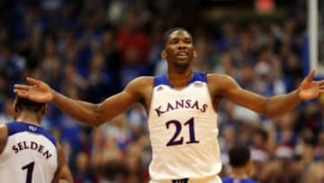 Dec 21, 2013; Lawrence, KS, USA; Kansas Jayhawks center Joel Embiid (21) celebrates after scoring during the second half of the game against the Georgetown Hoyas at Allen Fieldhouse. Kansas won 86-64. Mandatory Credit: Denny Medley-USA TODAY Sports