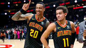 ATLANTA, GA - JANUARY 14: John Collins #20 stands with Trae Young #11 of the Atlanta Hawks following a game against the Phoenix Suns at State Farm Arena on January 14, 2020 in Atlanta, Georgia. NOTE TO USER: User expressly acknowledges and agrees that, by downloading and or using this photograph, User is consenting to the terms and conditions of the Getty Images License Agreement. (Photo by Carmen Mandato/Getty Images)