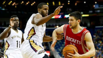 Oct 14, 2014; New Orleans, LA, USA; Houston Rockets forward Kostas Papanikolaou (16) is defended by New Orleans Pelicans forward Darius Miller (2) during the second half of a preseason game at the Smoothie King Center. The Pelicans defeated the Rockets 117-98. Mandatory Credit: Derick E. Hingle-USA TODAY Sports