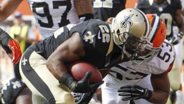 Sep 14, 2014; Cleveland, OH, USA; New Orleans Saints running back Mark Ingram (22) scores a touchdown against Cleveland Browns inside linebacker Craig Robertson (53) during the fourth quarter at FirstEnergy Stadium. The Browns won 26-24. Mandatory Credit: Ron Schwane-USA TODAY Sports