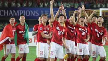 GUANGZHOU, CHINA - NOVEMBER 21: Players of Guangzhou Evergrande react by dancing after winning the Asian Champions League Final 2nd leg Match between Guangzhou Evergrande and Al Ahli at Tianhe Sports Center on November 21, 2015 in Guangzhou, China. (Photo by Zhong Zhi/Getty Images)