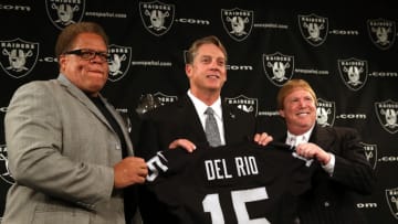 ALAMEDA, CA - JANUARY 16: Oakland Raiders new head coach Jack Del Rio (C) holds a jersey as he poses for a photograph with Raiders general manager Reggie McKenzie (L) and Raiders owner Mark Davis (R) during a news conference on January 16, 2015 in Alameda, California. The Oakland Raiders announced the hiring of Jack Del Rio as their new head coach. (Photo by Justin Sullivan/Getty Images)