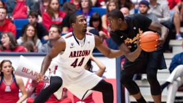 Nov 19, 2012; Tucson, AZ, USA; Arizona Wildcats forward Solomon Hill (44) defends Long Beach State 49ers guard/forward James Ennis (11) during the first half at McKale Center. The Wildcats beat the 49ers 94-72. Mandatory Credit: Casey Sapio-USA TODAY Sports
