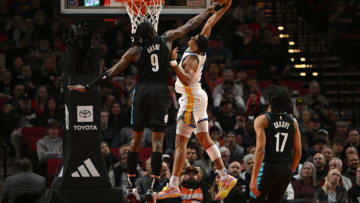 PORTLAND, OREGON - FEBRUARY 08: Jerami Grant #9 of the Portland Trail Blazers blocks Jordan Poole #3 of the Golden State Warriors shot during the first quarter at the Moda Center on February 08, 2023 in Portland, Oregon. NOTE TO USER: User expressly acknowledges and agrees that, by downloading and or using this photograph, User is consenting to the terms and conditions of the Getty Images License Agreement. (Photo by Alika Jenner/Getty Images)