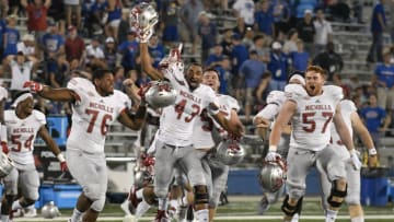 LAWRENCE, KS - SEPTEMBER 1: Members of the Nicholls State Colonels celebrate after a 26-23 win in overtime against the Kansas Jayhawks in the second quarter at Memorial Stadium on September 1, 2018 in Lawrence, Kansas. (Photo by Ed Zurga/Getty Images)
