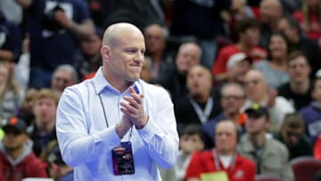 CLEVELAND, OH - MARCH 16: Head coach Cael Sanderson of the Penn State Nittany Lions smiles and applauds after Mark Hall won his match by fall during session four of the NCAA Wrestling Championships on March 16, 2018 at QuickenLoans Arena in Cleveland, Ohio. (Photo by Hunter Martin/Getty Images)