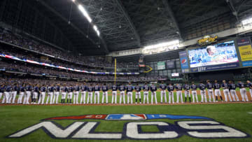 MILWAUKEE, WI - OCTOBER 12: Milwaukee Brewers players are seen during the national anthem before Game 1 of the NLCS against the Los Angeles Dodgers at Miller Park on Friday, October 12, 2018 in Milwaukee, Wisconsin. (Photo by Alex Trautwig/MLB Photos via Getty Images)