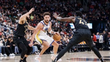 TORONTO, ON - DECEMBER 18: Fred VanVleet #23 and Pascal Siakam #43 of the Toronto Raptors defend against Klay Thompson #11 of the Golden State Warriors during the first half of their NBA game at Scotiabank Arena on December 18, 2022 in Toronto, Canada. NOTE TO USER: User expressly acknowledges and agrees that, by downloading and or using this photograph, User is consenting to the terms and conditions of the Getty Images License Agreement. (Photo by Cole Burston/Getty Images)