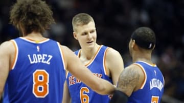 Jan 5, 2016; Atlanta, GA, USA; New York Knicks forward Kristaps Porzingis (6) celebrates a play with center Robin Lopez (8) and forward Carmelo Anthony (7) in the third quarter of their game the Atlanta Hawks at Philips Arena. The Knicks won 107-101. Mandatory Credit: Jason Getz-USA TODAY Sports