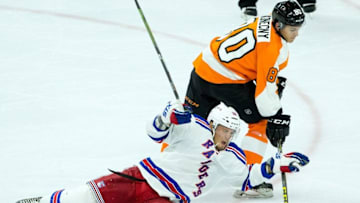 Sep 22, 2015; Philadelphia, PA, USA; Philadelphia Flyers center Travis Konecny (80) checks and steals the puck from New York Rangers center J.T. Miller (10) during the third period at Wells Fargo Center. The Flyers won 5-3. Mandatory Credit: Bill Streicher-USA TODAY Sports