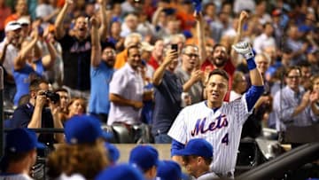 Jul 7, 2016; New York City, NY, USA; New York Mets first baseman Wilmer Flores (4) takes a curtain call after hitting a three run home run against the Washington Nationals during the fifth inning at Citi Field. Mandatory Credit: Brad Penner-USA TODAY Sports