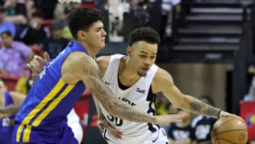 LAS VEGAS, NEVADA - JULY 10: Gui Santos #15 of the Golden State Warriors fouls Jordan Hall #30 of the San Antonio Spurs as he brings the ball up the court during the 2022 NBA Summer League at the Thomas & Mack Center on July 10, 2022 in Las Vegas, Nevada. NOTE TO USER: User expressly acknowledges and agrees that, by downloading and or using this photograph, User is consenting to the terms and conditions of the Getty Images License Agreement. (Photo by Ethan Miller/Getty Images)