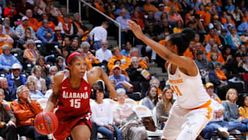 KNOXVILLE, TN - JANUARY 31: Meoshanti Knight #15 of the Alabama Crimson Tide drives against Diamond DeShields #11 of the Tennessee Lady Volunteers in a game at Thompson-Boling Arena on January 31, 2016 in Knoxville, Tennessee. (Photo by Patrick Murphy-Racey/Getty Images)