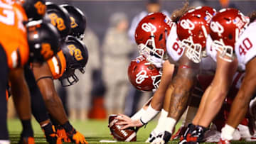 Nov 28, 2015; Stillwater, OK, USA; Oklahoma Sooners line up against the Oklahoma State Cowboys as they prepare to snap the ball at Boone Pickens Stadium. The Sooners defeated the Cowboys 58-23. Mandatory Credit: Mark J. Rebilas-USA TODAY Sports