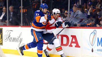 Apr 17, 2016; Brooklyn, NY, USA; New York Islanders left wing Matt Martin (17) hits Florida Panthers defenseman Alex Petrovic (6) during the second period of game three of the first round of the 2016 Stanley Cup Playoffs at Barclays Center. Mandatory Credit: Brad Penner-USA TODAY Sports