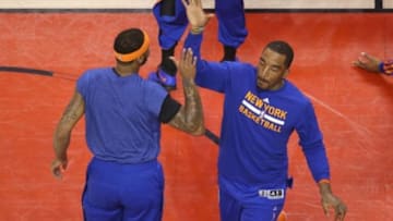 Apr 11, 2014; Toronto, Ontario, CAN; New York Knicks forward J.R. Smith (8) is introduced before the game as forward Carmelo Anthony (7) greets him against the Toronto Raptors at Air Canada Centre. The Knicks beat the Raptors 108-100. Mandatory Credit: Tom Szczerbowski-USA TODAY Sports