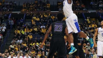 Mar 21, 2014; St. Louis, MO, USA; Kentucky Wildcats forward Julius Randle (30) dunks the ball past Kansas State Wildcats guard Nigel Johnson (23) in the first half during the 2nd round of the 2014 NCAA Men