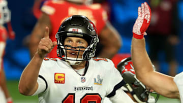 TAMPA, FLORIDA - FEBRUARY 07: Tom Brady #12 of the Tampa Bay Buccaneers reacts after a 27 yard touchdown run by Leonard Fournette #28 in the third quarter against the Kansas City Chiefs in Super Bowl LV at Raymond James Stadium on February 07, 2021 in Tampa, Florida. (Photo by Mike Ehrmann/Getty Images)