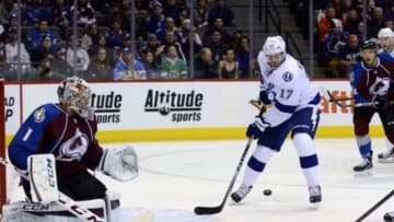 Feb 22, 2015; Denver, CO, USA; Tampa Bay Lightning center Alex Killorn (17) attempts to deflect the puck at Colorado Avalanche goalie Semyon Varlamov (1) in the first period at the Pepsi Center. Mandatory Credit: Ron Chenoy-USA TODAY Sports