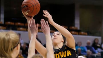 Mar 03 2016: Iowa Hawkeyes forward Megan Gustafson (10) puts her shot over Michigan Wolverines guard Nicole Munger (10) during the Women's Big Ten Tournament game between the Michigan vs Iowa at Bankers Life Fieldhouse in Indianapolis, IN. (Photo by Jeffrey Brown/Icon Sportswire) (Photo by Jeffrey Brown/Icon Sportswire/Corbis via Getty Images)