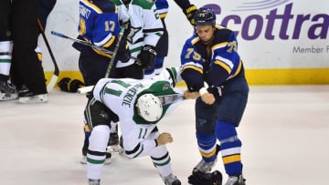 May 3, 2016; St. Louis, MO, USA; St. Louis Blues right wing Ryan Reaves (75) fights with Dallas Stars left wing Curtis McKenzie (11) during the third period in game three of the second round of the 2016 Stanley Cup Playoffs at Scottrade Center. The St. Louis Blues defeat the Dallas Stars 6-1. Mandatory Credit: Jasen Vinlove-USA TODAY Sports