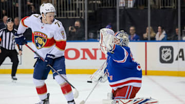 Feb 1, 2022; New York, New York, USA; New York Rangers goaltender Igor Shesterkin (31) makes a save in front of Florida Panthers center Frank Vatrano (77) during the first period at Madison Square Garden. Mandatory Credit: Vincent Carchietta-USA TODAY Sports