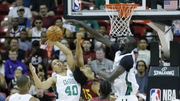 LAS VEGAS, NEVADA - JULY 08: Grant Williams #40 and Tacko Fall #55 of the Boston Celtics block a shot by Naz Mitrou-Long #15 of the Cleveland Cavaliers during the 2019 NBA Summer League at the Thomas & Mack Center on July 08, 2019 in Las Vegas, Nevada. NOTE TO USER: User expressly acknowledges and agrees that, by downloading and or using this photograph, User is consenting to the terms and conditions of the Getty Images License Agreement. (Photo by Michael Reaves/Getty Images)
