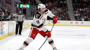 CLEVELAND, OH - DECEMBER 30: Grand Rapids Griffins defenceman Dylan McIlrath (52) passes the puck during the first period of the American Hockey League game between the Grand Rapids Griffins and Cleveland Monsters on December 30, 2017, at Quicken Loans Arena in Cleveland, OH. Grand Rapids defeated Cleveland 5-3. (Photo by Frank Jansky/Icon Sportswire via Getty Images)