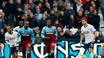 Tottenham Hotspur's English striker Harry Kane (C) reacts after he is hit on the head by the ball during the English Premier League football match between West Ham United and Tottenham Hotspur at The London Stadium, in east London on November 23, 2019. (Photo by Adrian DENNIS / AFP) / RESTRICTED TO EDITORIAL USE. No use with unauthorized audio, video, data, fixture lists, club/league logos or 'live' services. Online in-match use limited to 120 images. An additional 40 images may be used in extra time. No video emulation. Social media in-match use limited to 120 images. An additional 40 images may be used in extra time. No use in betting publications, games or single club/league/player publications. / (Photo by ADRIAN DENNIS/AFP via Getty Images)