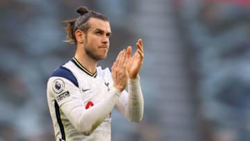 Tottenham Hotspur's Welsh midfielder Gareth Bale gestures to fans refusing to leave after the English Premier League football match between Tottenham Hotspur and Aston Villa at Tottenham Hotspur Stadium in London, on May 19, 2021. - - RESTRICTED TO EDITORIAL USE. No use with unauthorized audio, video, data, fixture lists, club/league logos or 'live' services. Online in-match use limited to 120 images. An additional 40 images may be used in extra time. No video emulation. Social media in-match use limited to 120 images. An additional 40 images may be used in extra time. No use in betting publications, games or single club/league/player publications. (Photo by Richard Heathcote / POOL / AFP) / RESTRICTED TO EDITORIAL USE. No use with unauthorized audio, video, data, fixture lists, club/league logos or 'live' services. Online in-match use limited to 120 images. An additional 40 images may be used in extra time. No video emulation. Social media in-match use limited to 120 images. An additional 40 images may be used in extra time. No use in betting publications, games or single club/league/player publications. / RESTRICTED TO EDITORIAL USE. No use with unauthorized audio, video, data, fixture lists, club/league logos or 'live' services. Online in-match use limited to 120 images. An additional 40 images may be used in extra time. No video emulation. Social media in-match use limited to 120 images. An additional 40 images may be used in extra time. No use in betting publications, games or single club/league/player publications. (Photo by RICHARD HEATHCOTE/POOL/AFP via Getty Images)