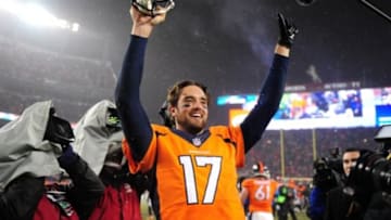 Nov 29, 2015; Denver, CO, USA; Denver Broncos quarterback Brock Osweiler (17) celebrates following the overtime against the New England Patriots at Sports Authority Field at Mile High. The Broncos defeated the Patriots 30-24 in overtime. Mandatory Credit: Ron Chenoy-USA TODAY Sports